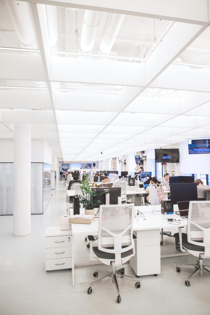 pexels-photo-3778619-3778619 Spacious and well-lit office interior with modern furniture and workstations, ideal for a dynamic work environment.